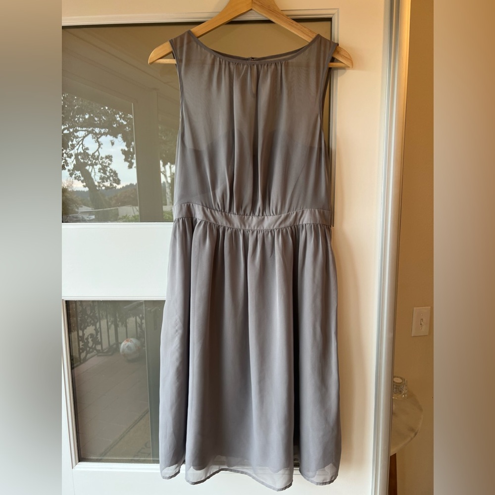 Gorgeous grey sleeveless sweetheart and sheer dress.